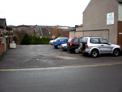 Entrance to Marshall and Till car park beyond New Ming Court